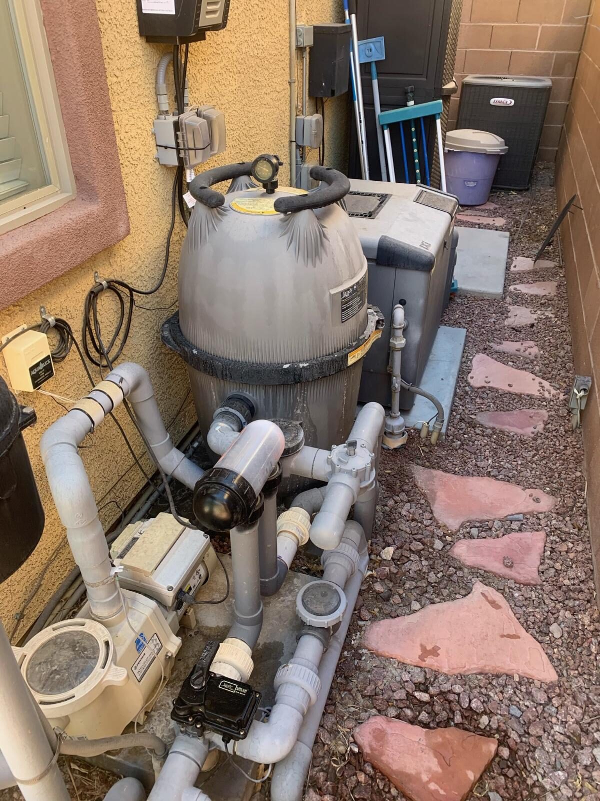 Complete residential pool equipment pad with pump, filter, plumbing, and controls